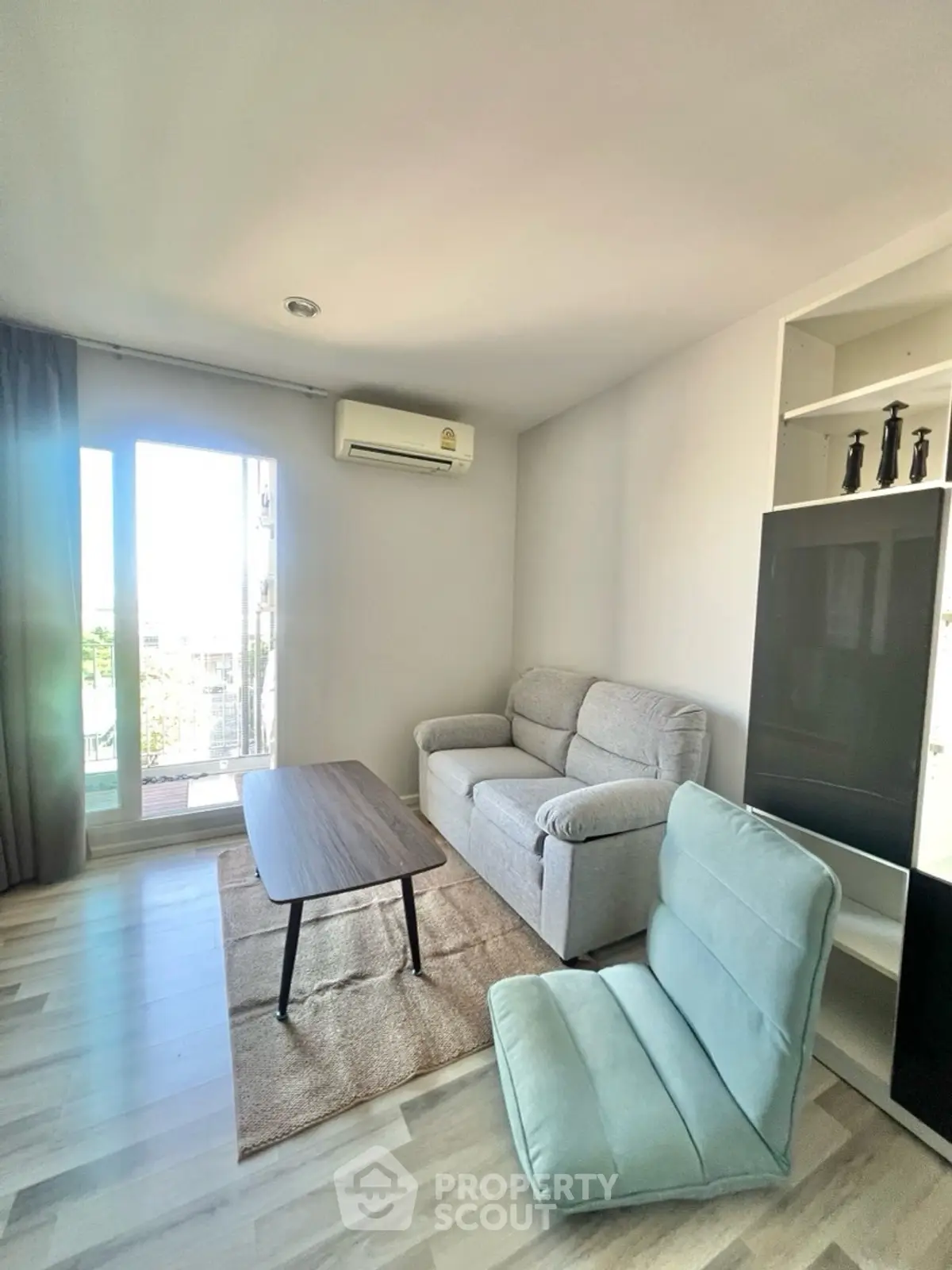 Modern living room with cozy sofa and large window view