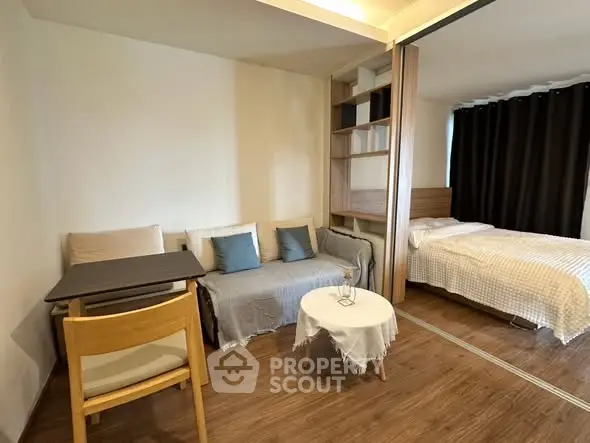 Cozy studio apartment with modern furnishings and wooden flooring