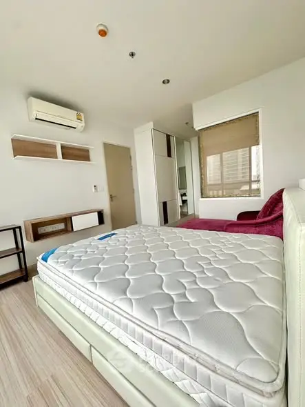 Modern bedroom with air conditioning and stylish decor in a bright apartment.
