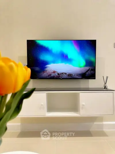 Modern living room with wall-mounted TV and elegant decor