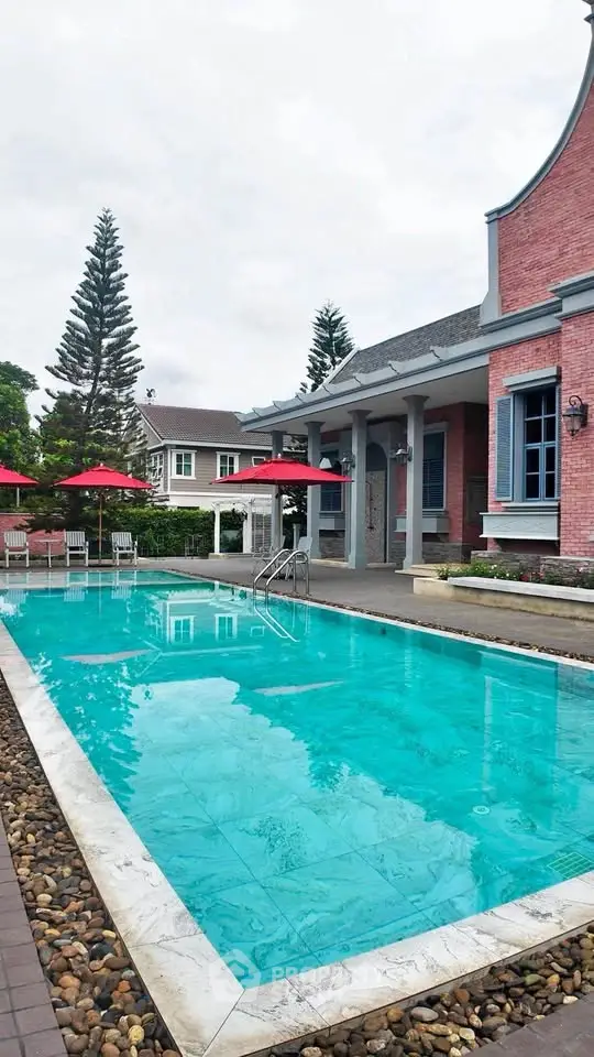Charming residential property with inviting pool and elegant architecture, perfect for luxury living.