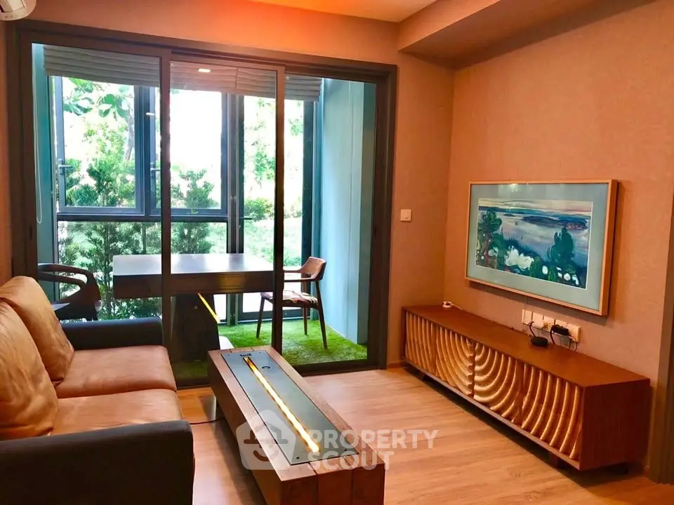 Stylish living room with modern decor and garden view, featuring elegant furniture and natural light.
