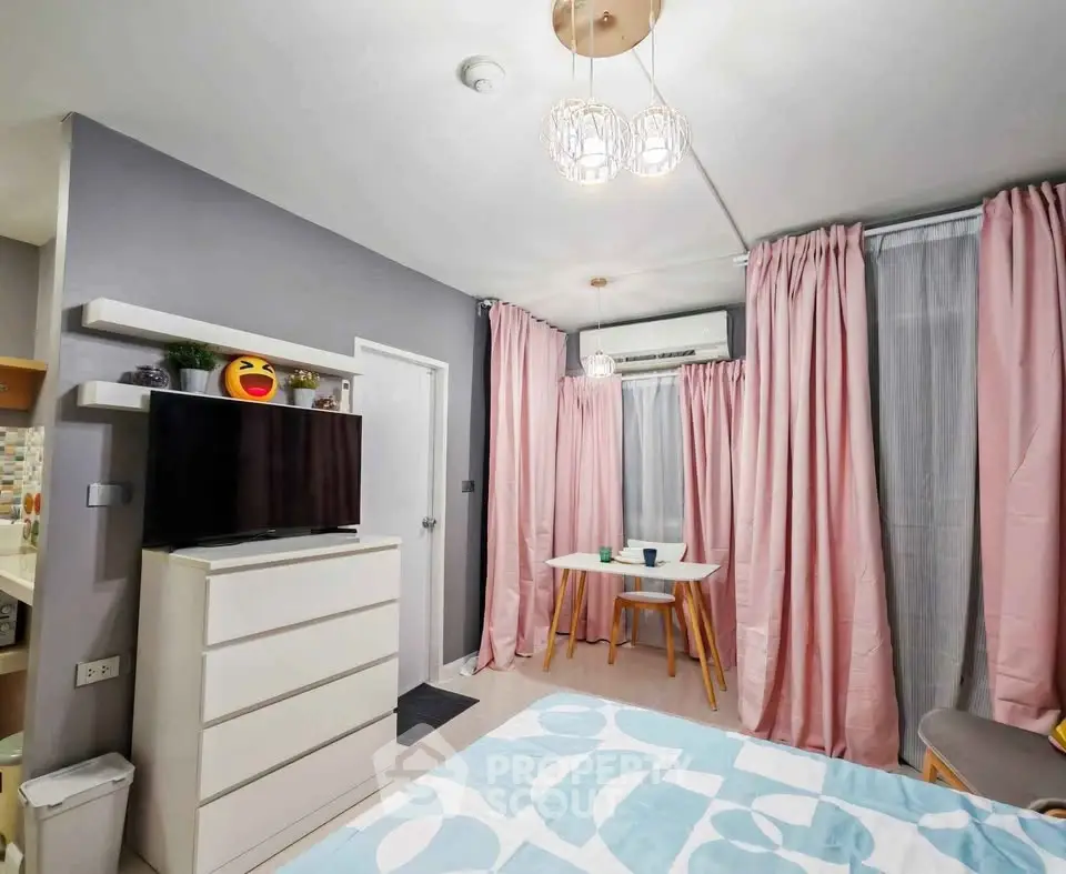 Charming bedroom with modern decor and cozy dining area, perfect for urban living.