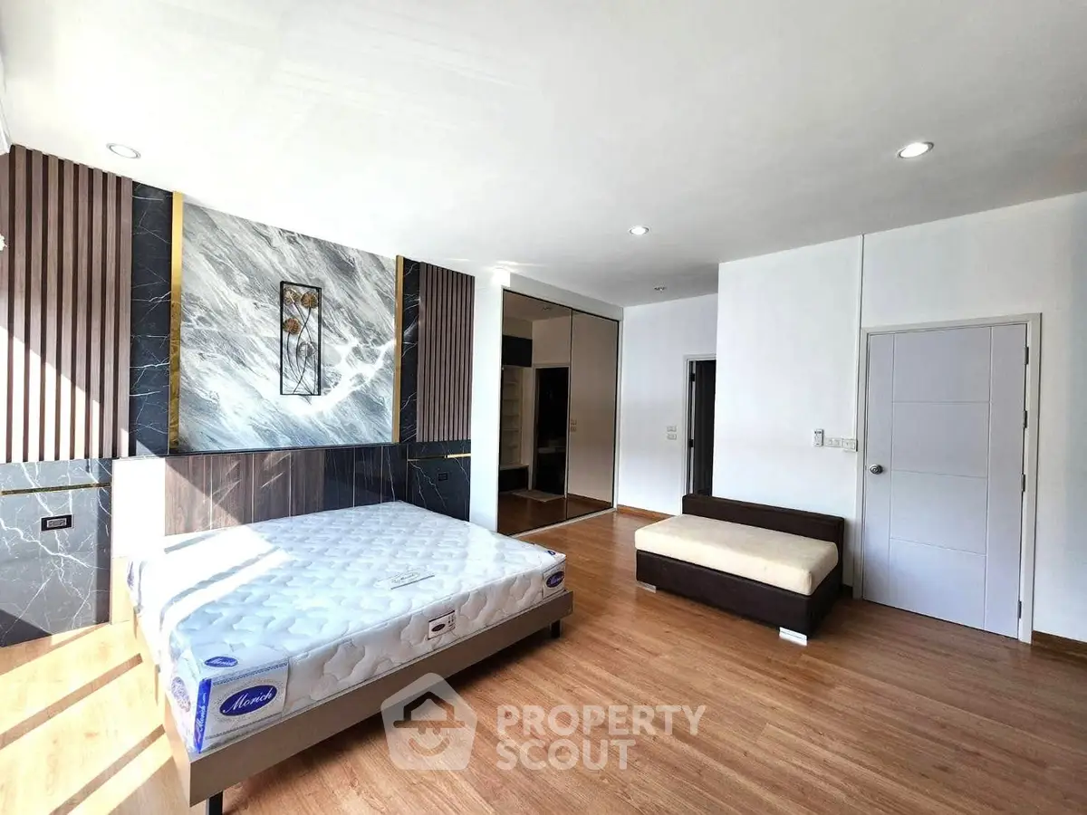 Spacious modern bedroom with elegant design and natural light