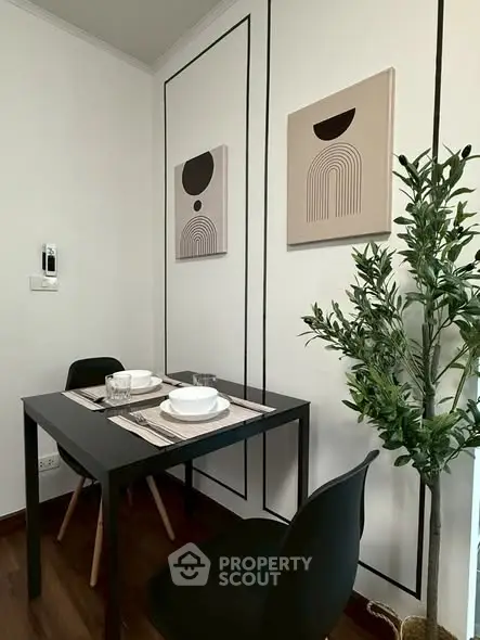 Modern dining nook with minimalist decor and stylish wall art