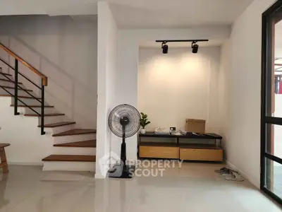 Modern interior with sleek staircase and minimalist decor, perfect for contemporary living.