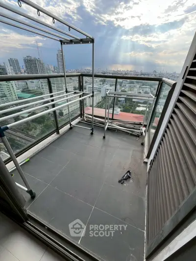 Spacious balcony with stunning city view, perfect for relaxation and enjoying sunsets.