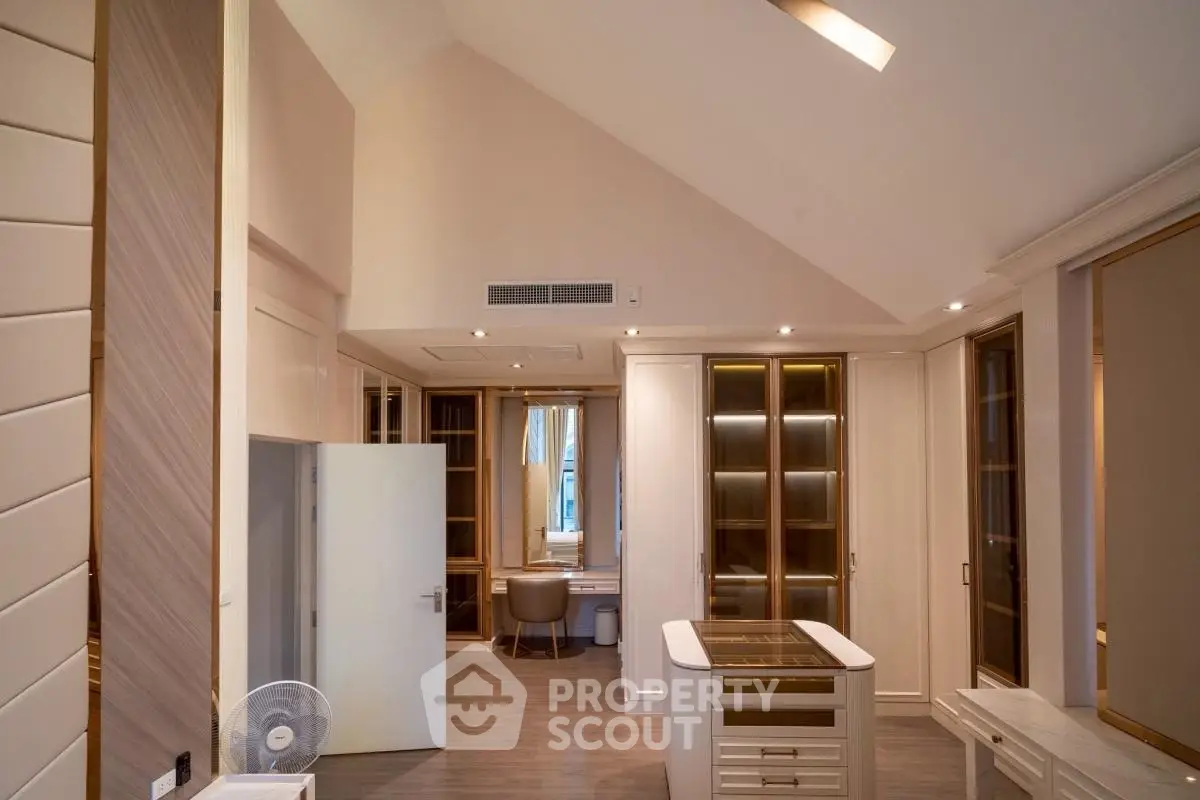 Luxurious modern kitchen with high ceilings and elegant cabinetry