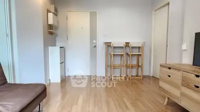 Modern living room with wooden flooring and minimalist furniture