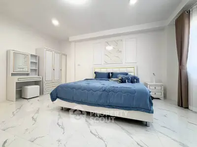 Spacious modern bedroom with elegant decor and marble flooring