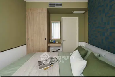 Stylish bedroom with modern decor and cozy ambiance, featuring a comfortable bed and elegant furnishings.