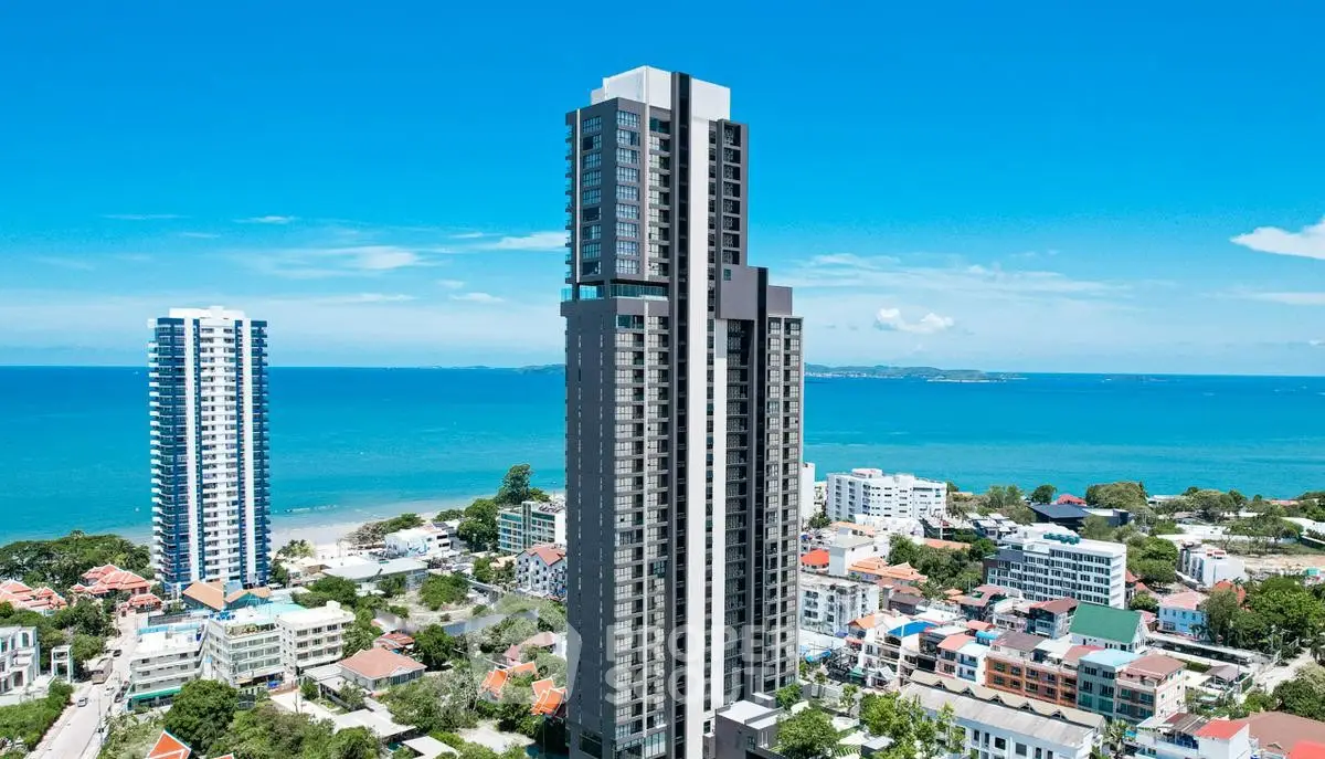 Stunning high-rise building with ocean view in vibrant coastal cityscape.