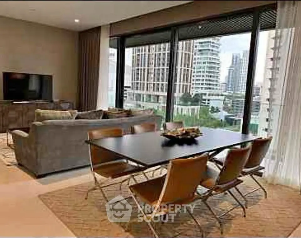 Modern living room with dining area and city view, featuring stylish furniture and large windows.