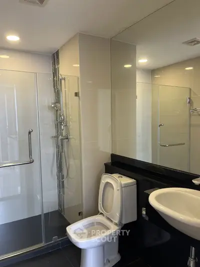 Modern bathroom with glass shower and sleek fixtures