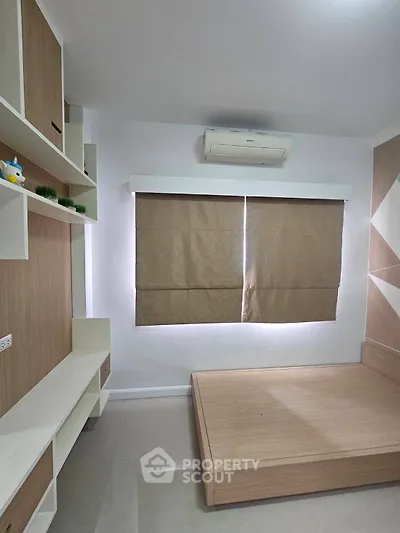 Modern minimalist bedroom with built-in storage and air conditioning