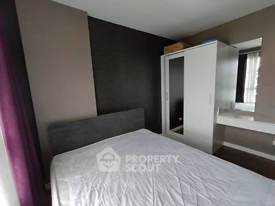 Modern bedroom with sleek wardrobe and minimalist decor