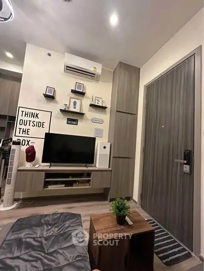 Modern living room with stylish decor and wall-mounted TV