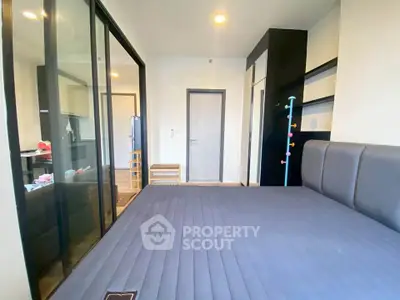 Modern bedroom with sleek design and glass partition in stylish apartment