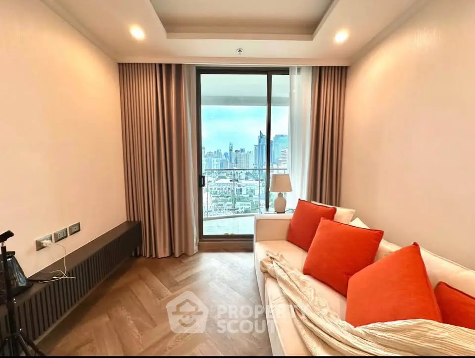 Modern living room with city view and cozy sofa in high-rise apartment.