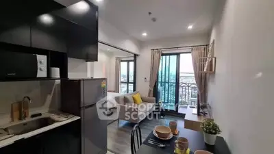 Modern open-layout apartment with kitchen and living room, featuring balcony with city view.