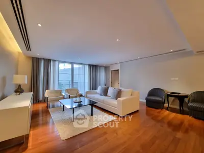 Spacious modern living room with elegant decor and hardwood floors