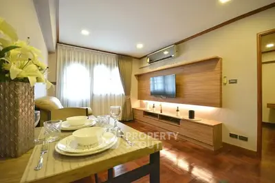Spacious living room with modern decor and elegant dining setup