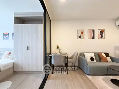 Modern living room with stylish decor and cozy seating area in a contemporary apartment.