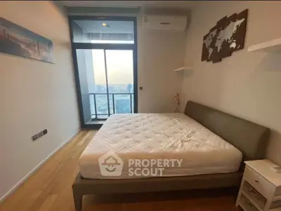 Modern bedroom with city view and stylish decor in high-rise apartment