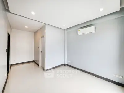Spacious modern living room with sleek air conditioning and glossy floors