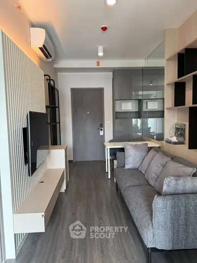 Modern living room with sleek furniture and stylish decor in a contemporary apartment.