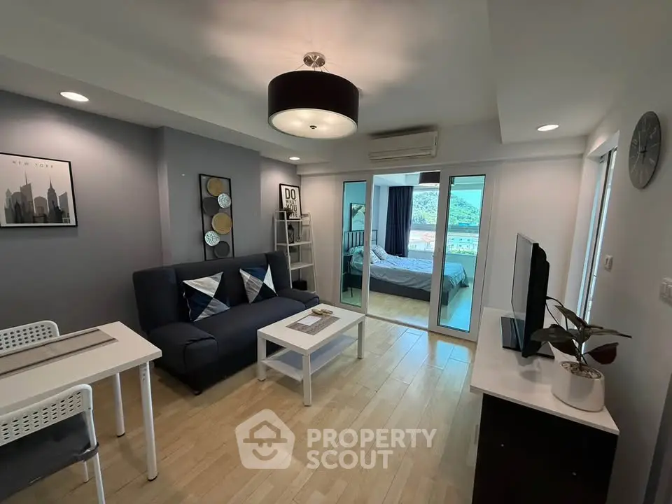 Modern open-plan living room with stylish decor and natural light