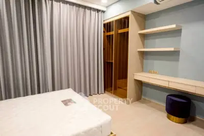 Modern bedroom with built-in closet and stylish shelving
