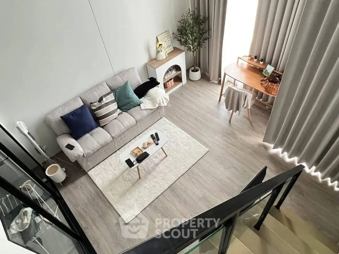 Modern living room with stylish decor and cozy seating area, perfect for relaxation and entertaining.
