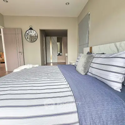 Modern bedroom with stylish decor and cozy bedding