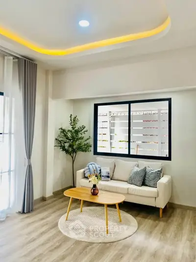 Bright and modern living room with cozy sofa and stylish decor