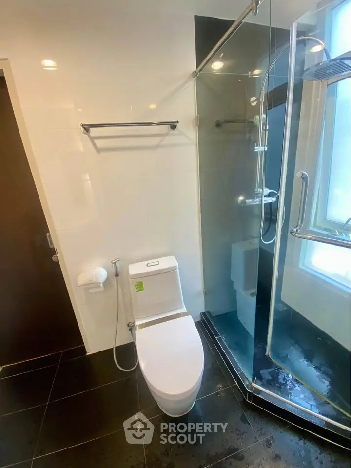 Modern bathroom with glass shower and sleek fixtures