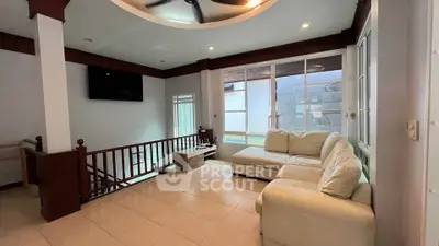 Spacious living room with modern decor and natural light