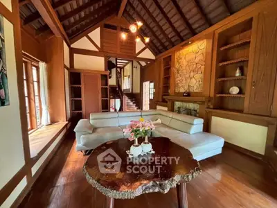 Charming rustic living room with high ceilings and cozy fireplace