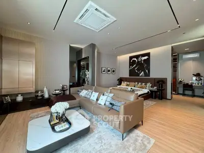 Luxurious open-plan living room with modern decor and cozy seating area