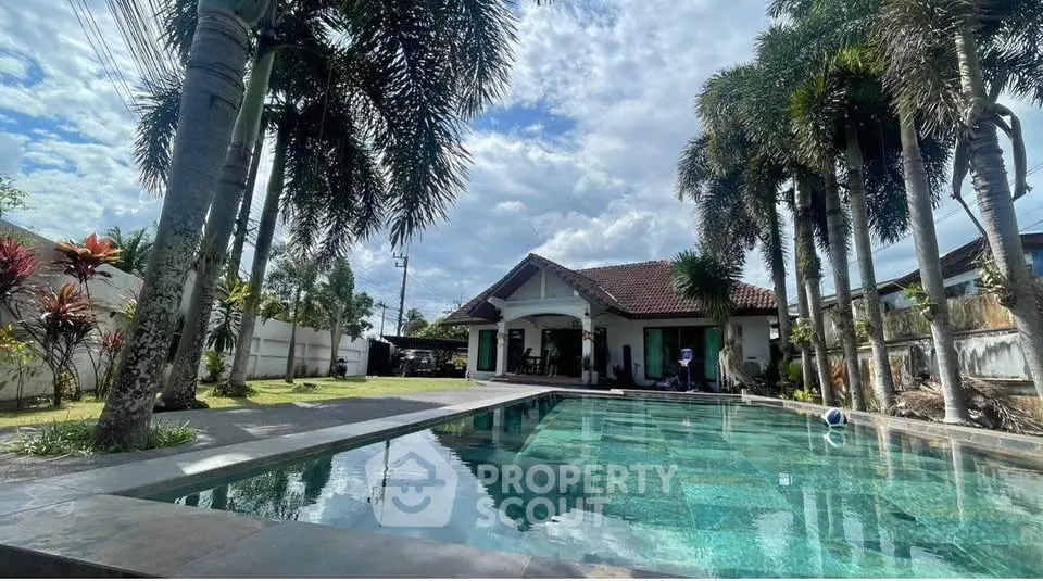Stunning tropical villa with private pool and lush garden, perfect for luxurious living and relaxation.