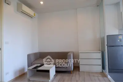 Modern living room with sleek furniture and air conditioning in a cozy apartment.