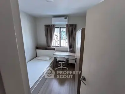 Cozy bedroom with modern furnishings and natural light, perfect for a peaceful retreat.