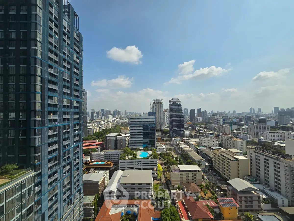 Stunning cityscape view from high-rise building showcasing urban skyline and vibrant city life.