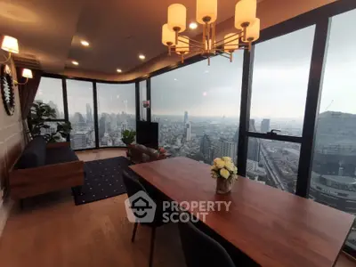 Luxurious high-rise apartment with stunning city skyline view and elegant interior design.