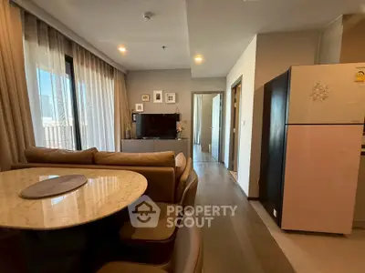 Modern living room with dining area and kitchen in open layout apartment