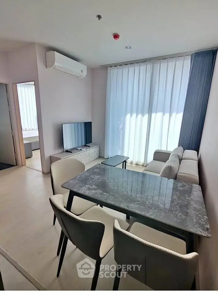 Modern living room with sleek furniture and natural light