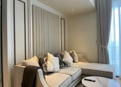 Luxurious modern living room with elegant sofa and floor-to-ceiling windows.