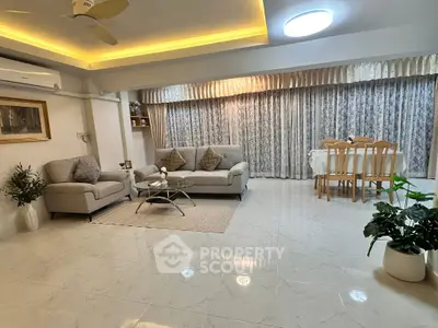 Spacious living room with elegant decor and dining area