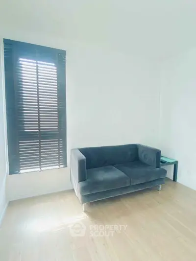 Minimalist living room with modern sofa and wooden floor