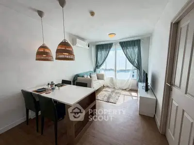 Bright and airy living room with modern decor and large windows in a stylish apartment.